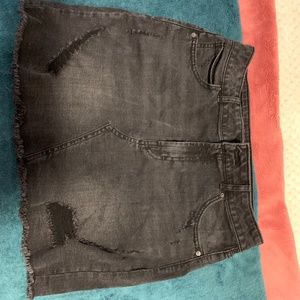 Distressed black denim skirt